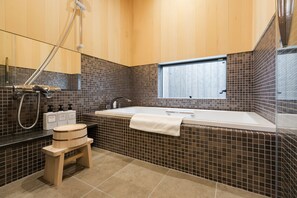 Combined shower/tub, free toiletries, hair dryer, slippers