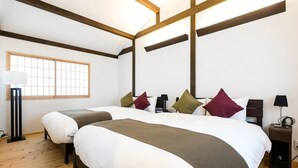 A bedroom with a large bed, a nightstand, a lamp, and a window with a view. - No.8 Kyoto (Kyoto)