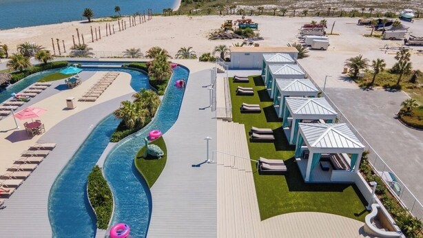 A resort with a swimming pool, sun loungers, and beach views. - DOWN BY THE BAY! 2nd floor unit, AMAZING views! 65”TV! ASK ABOUT DISCOUNTS! (Orange Beach)