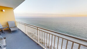 A balcony with a view of the ocean, a railing, and two chairs. - Splash 606W Master Gulf View Free Beach Service, Golf & Activities Daily (Panama City Beach)