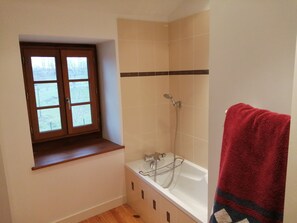 Bathtub, hair dryer, bidet, towels