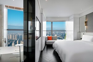 Premium bedding, down comforters, free minibar, in-room safe