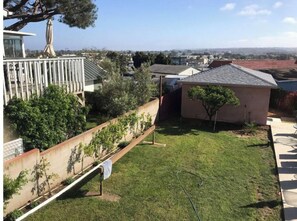 Enjoy a serene outdoor space with a well-maintained lawn and garden, perfect for relaxation.