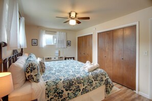 A bedroom with a bed, a nightstand, a ceiling fan, a window with curtains, a wardrobe, and a bedside lamp. - 0651: Central Salida Home 5 Blocks to Dtwn & River (Salida)