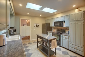 A modern kitchen with a built-in oven, microwave, and refrigerator. - 0651: Central Salida Home 5 Blocks to Dtwn & River (Salida)