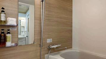 Bathtub, hair dryer, towels