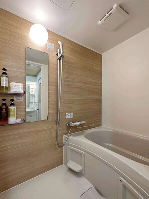 Bathtub, hair dryer, towels