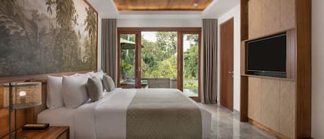 A modern bedroom with a large bed, a television, and a mural on the wall.