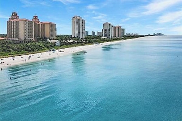 On the beach, sun loungers, beach towels