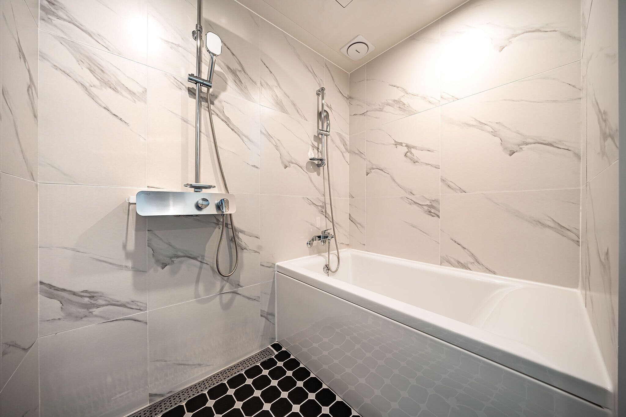 superior double room | bathroom | separate bathtub and shower, designer toiletries, hair dryer, bathrobes