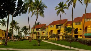 A resort with multiple-story buildings, palm trees, and well-maintained lawns. - Gorgeous View- Beach Village at Palmas Del Mar (Palmas del Mar)
