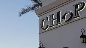 A building with the word "CHOP" illuminated on its facade. - Picture Perfect 2/2 with Views Galore! The Cays at Ocotillo! 30 Night Minimum Stay! (Chandler)