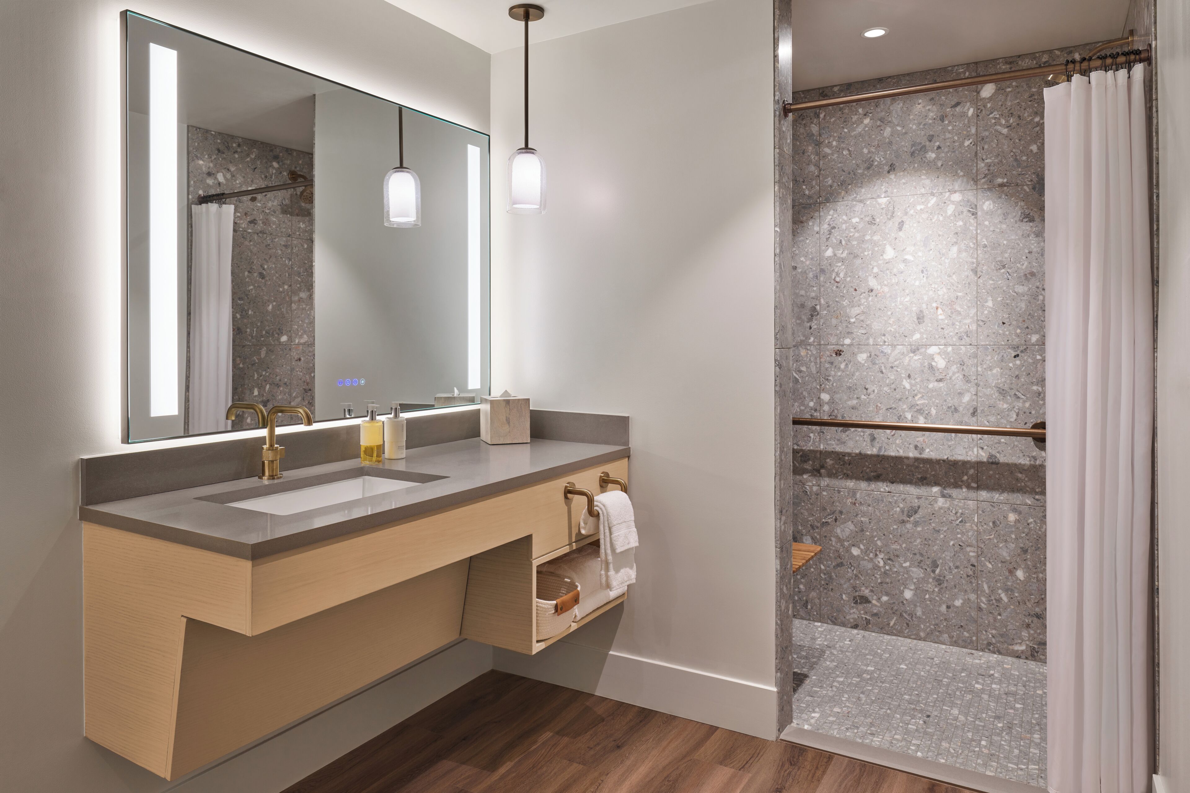 designer toiletries, hair dryer, bathrobes, slippers