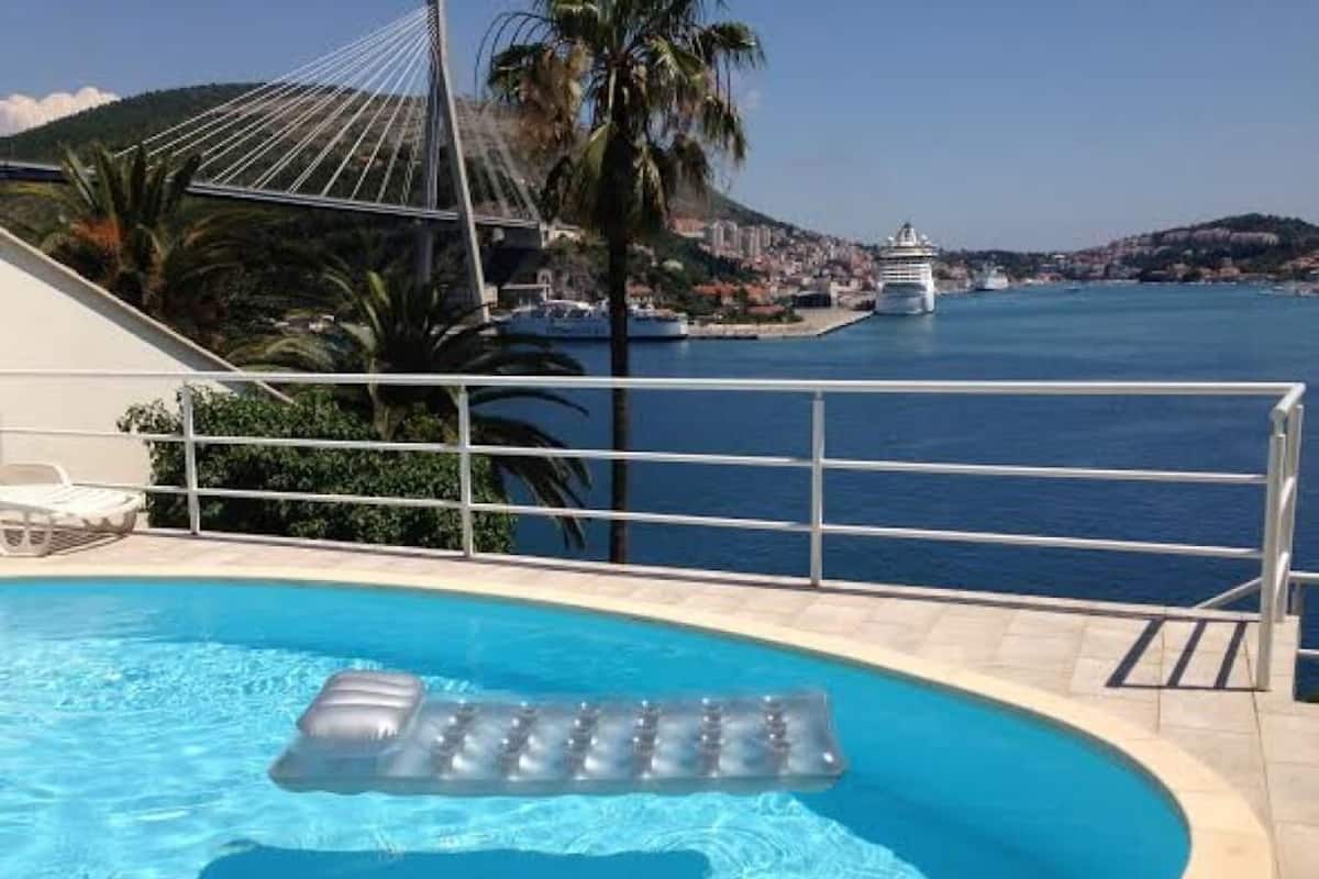 Seasonal outdoor pool, pool umbrellas, pool loungers