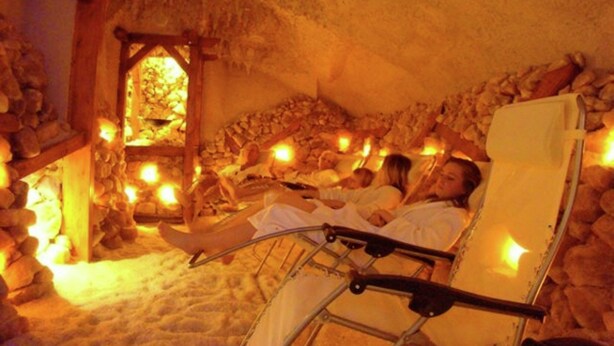 A room with stone walls and a thatched roof, containing several reclining chairs with people lying down. - Comfortable Chalet With Dishwasher, Near Maastricht (Susteren)