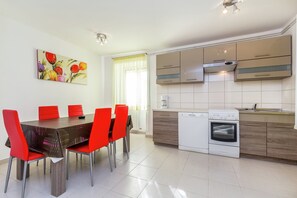 Appartement | Cuisine privée | Table de salle à manger
