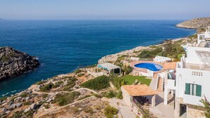 A coastal property with a swimming pool, a patio area, and a view of the sea. - Luxury Villa With Amazing Sea Views, Private Pool, Near the Beach (Chania)