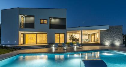 A Modern Luxury Villa With a Crystal-clear Swimming Pool and Cultivated Garden