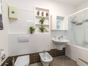 Bathtub, hair dryer, towels