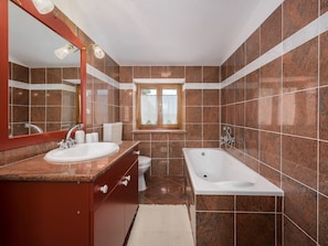 Bathtub, hair dryer, towels