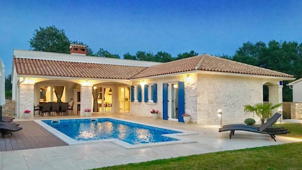 A two-story house with a swimming pool, outdoor seating, and a covered patio area. - Comfortable Villa With Private Swimming Pool, Table Football, Near Labin (Sveta Nedelja)