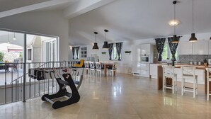 A spacious living area with a foosball table, a dining area, and a kitchen. - Comfortable Villa With Private Swimming Pool, Table Football, Near Labin (Sveta Nedelja)