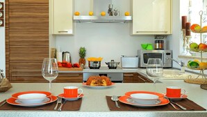 A modern kitchen with a central island, a microwave, a toaster, and a coffee maker. - Villa in Novigrad With Pool Near Beach (Novigrad)