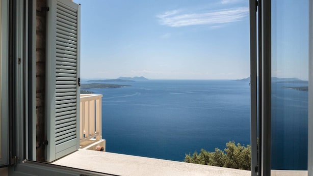 A balcony with a view of the sea and distant islands. - Modern Villa in Vasiliki with Swimming Pool & Hot Tub (Lefkada)