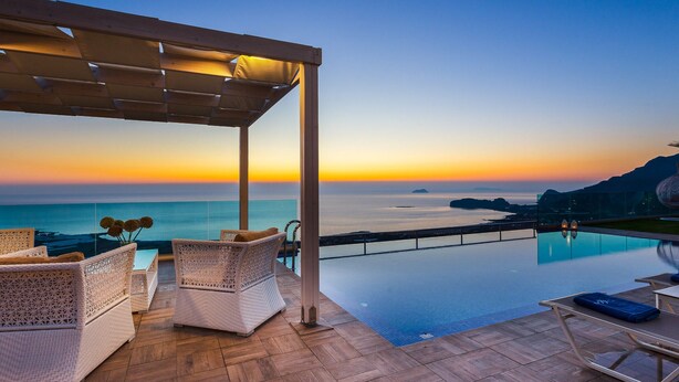 A rooftop terrace with a pool, overlooking the sea at sunset. - Scenic Villa With Private Pool (Kissamos)