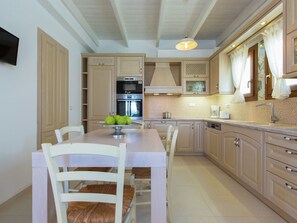 Villa | Private kitchen | Electric kettle, toaster, highchair, cookware/dishes/utensils