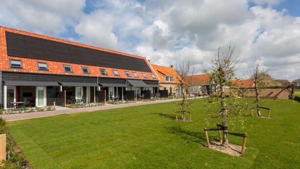 A modern building with a flat roof and multiple windows. - Holiday Home in Oostkapelle Near Beach (Oostkapelle)