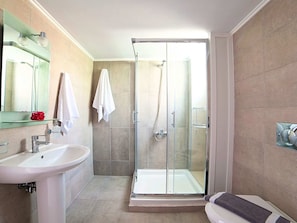 A modern bathroom with a glass-enclosed shower, a sink, and a toilet. - New Beautiful Villa With Private Pool at Coastal Area Just Outside Rethymno, NW (Apokoronas)