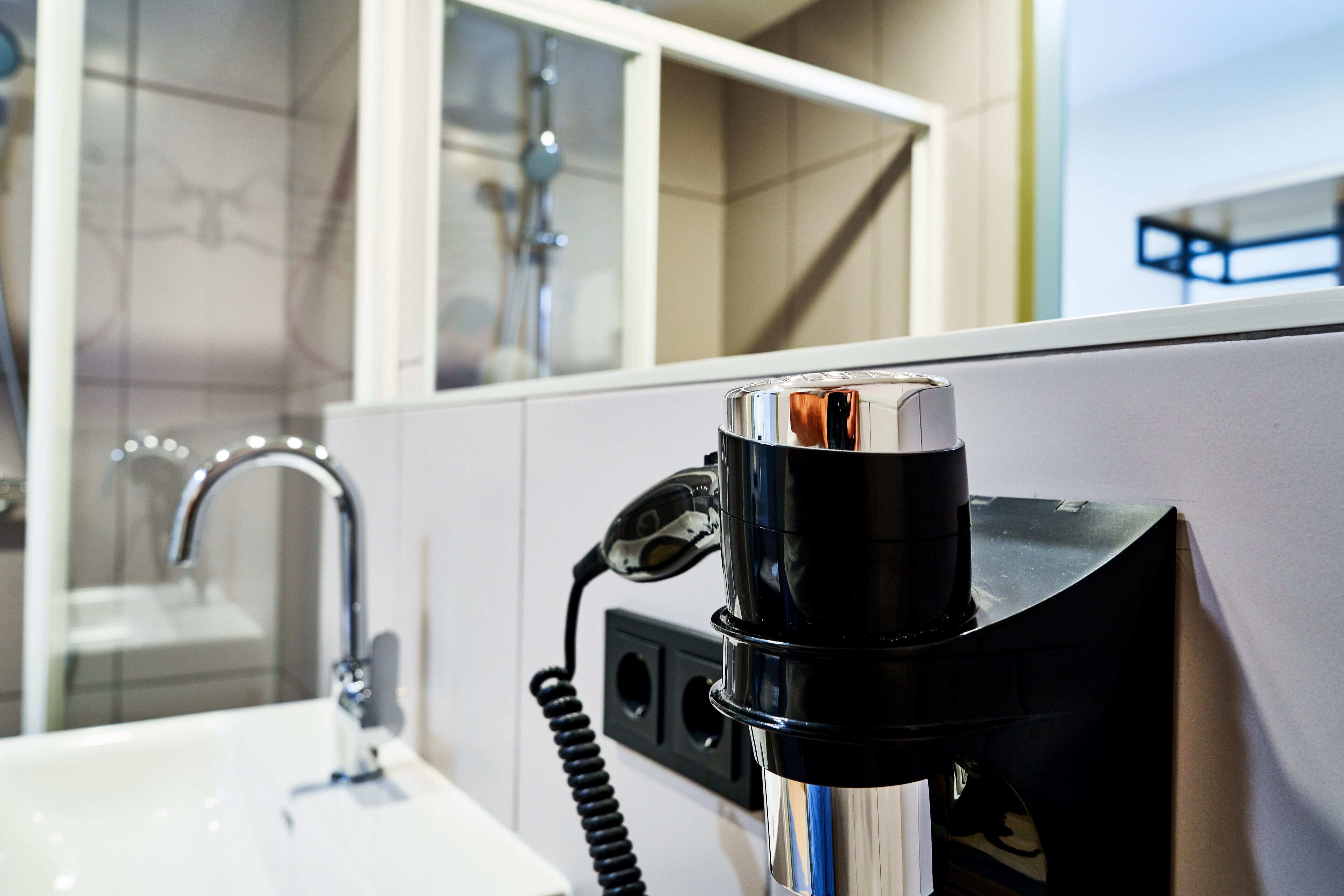 shower, rainfall showerhead, hair dryer, towels