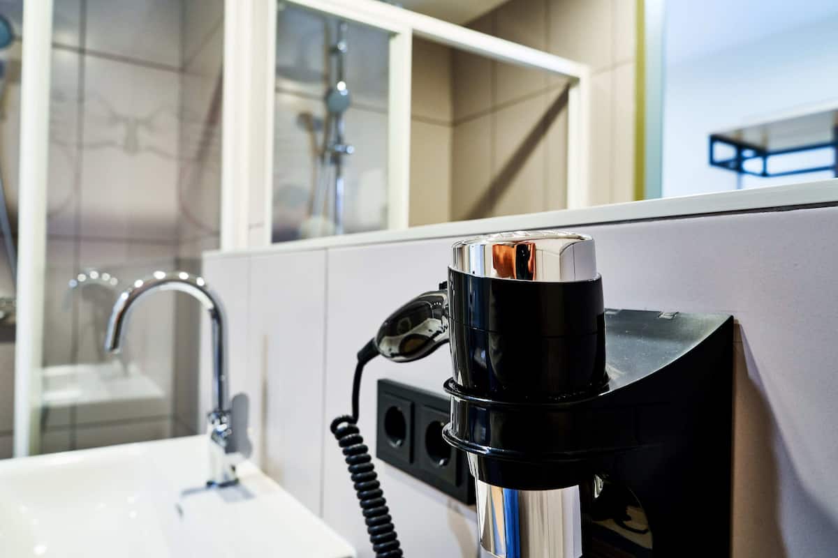 shower, rainfall showerhead, hair dryer, towels