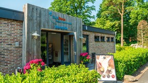A building with a sign reading "EuroParcs Resort Kettering." - Modern Chalet With Dishwasher, Near National Park (IJhorst)