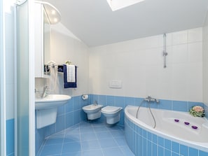 Bathtub, hair dryer, towels