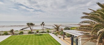 Superb beach house with beautiful garden with hot tub and private beach access