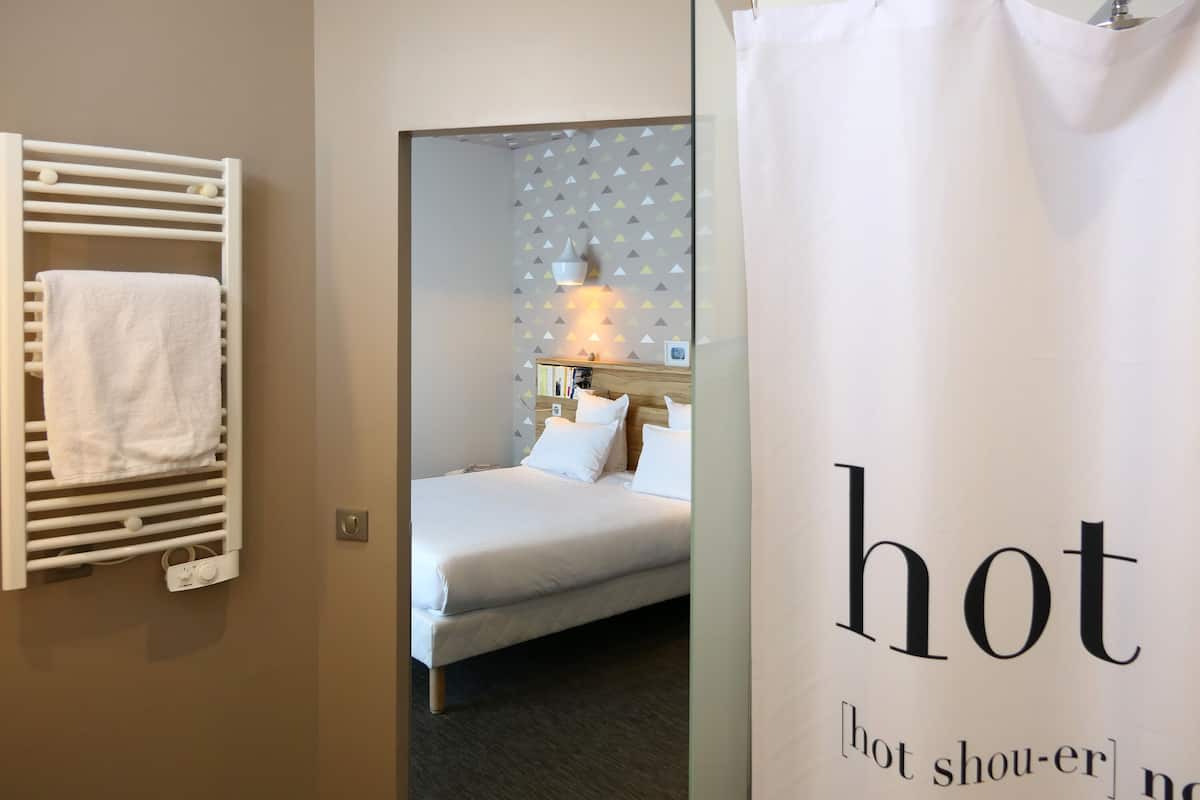 shower, rainfall showerhead, hair dryer, towels