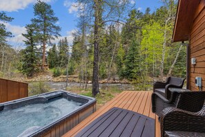 Terrace/patio - Spacious Riverfront Retreat • Private Hot Tub • Close to RMNP (Estes Park)