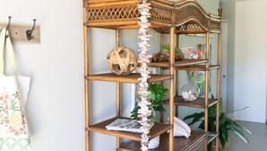 A room with a wooden bookshelf, a wicker basket, and a white storage bin with a heart design. - Family Retreat South Spacious 4BR, 4BA Getaway (Sebastian)