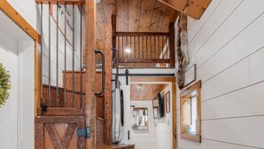 A wooden staircase with a rustic design, leading to a lofted area. - SUPER CUTE & CLEAN MODERN HOME 40 min. to YNP (Island Park)