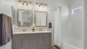 Combined shower/tub, hair dryer, towels, soap