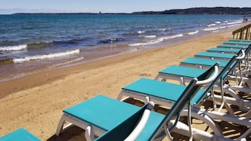 Private beach, white sand, sun loungers