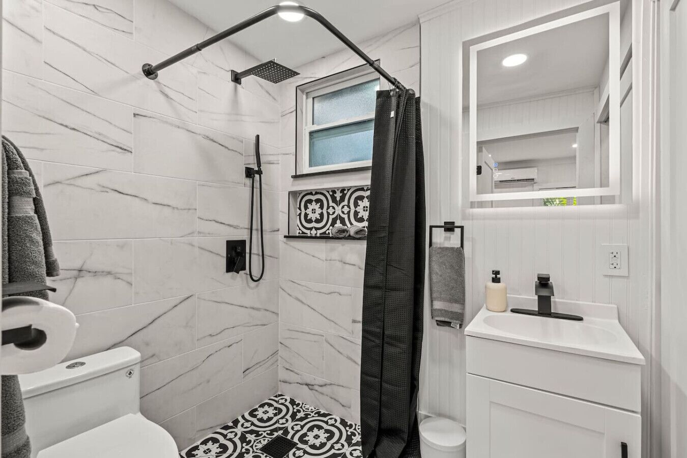 Shower, hair dryer, towels, toilet paper