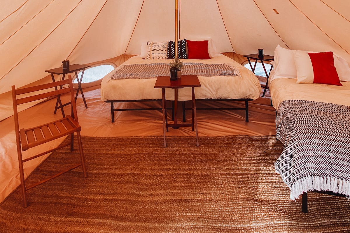 Family Tent With Shared Bathroom | Down comforters, individually decorated, individually furnished