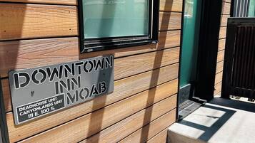 A sign for Downtown Inn Moab, indicating the location at 111 E. 100 S.