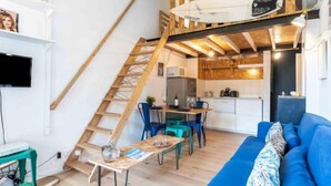 A compact living space with a loft area, a dining area, and a kitchen. - Kantaldi by Interhome (Guethary)