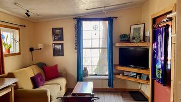 Flat-screen TV, DVD player, books