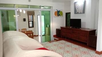 Villa | Living area | 32-inch flat-screen TV with cable channels, TV