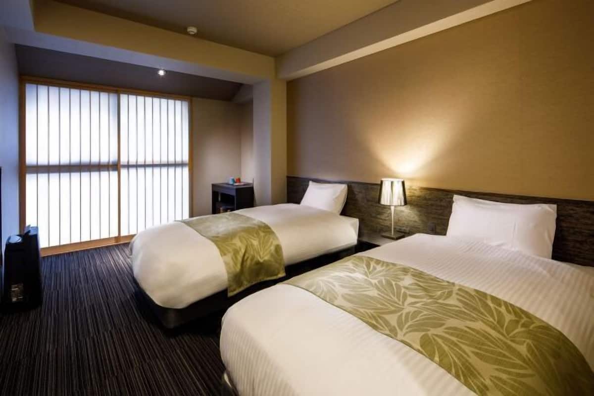 Down duvets, pillow-top beds, desk, blackout curtains